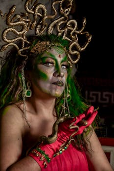 A captivating portrait of a Medusa-themed costume with vibrant makeup and snake-like accessories.
