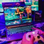 Colorful gaming scene on a laptop with controller, perfect for entertainment visuals.